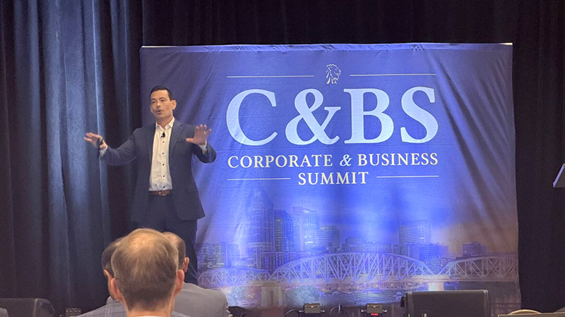 4-years-annual-speaker-800x450 Alexander Jones on stage.