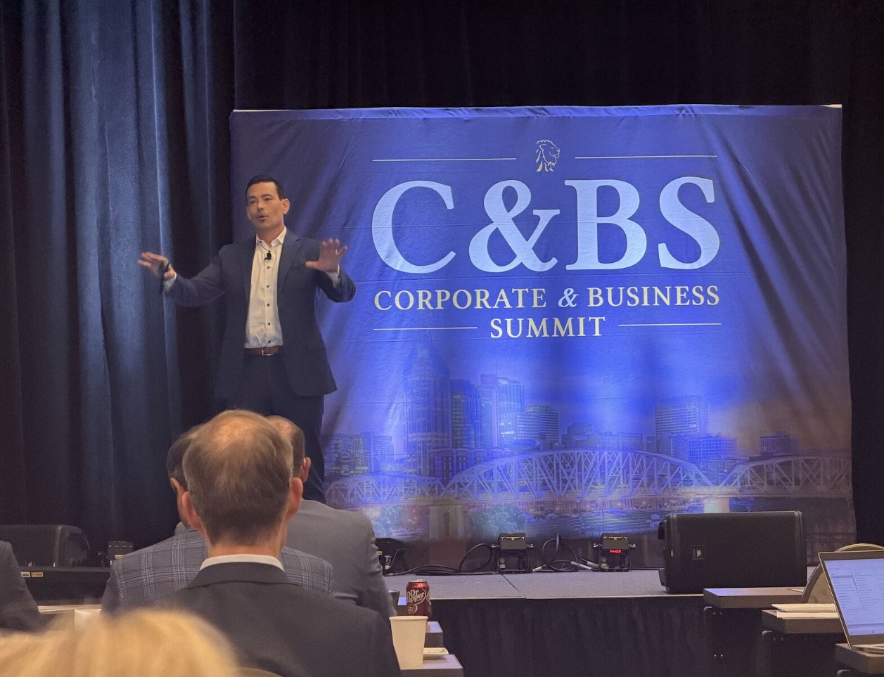 Alex Jones presenting at the Lion Street Corporate & Business Solutions Summit in Nashville