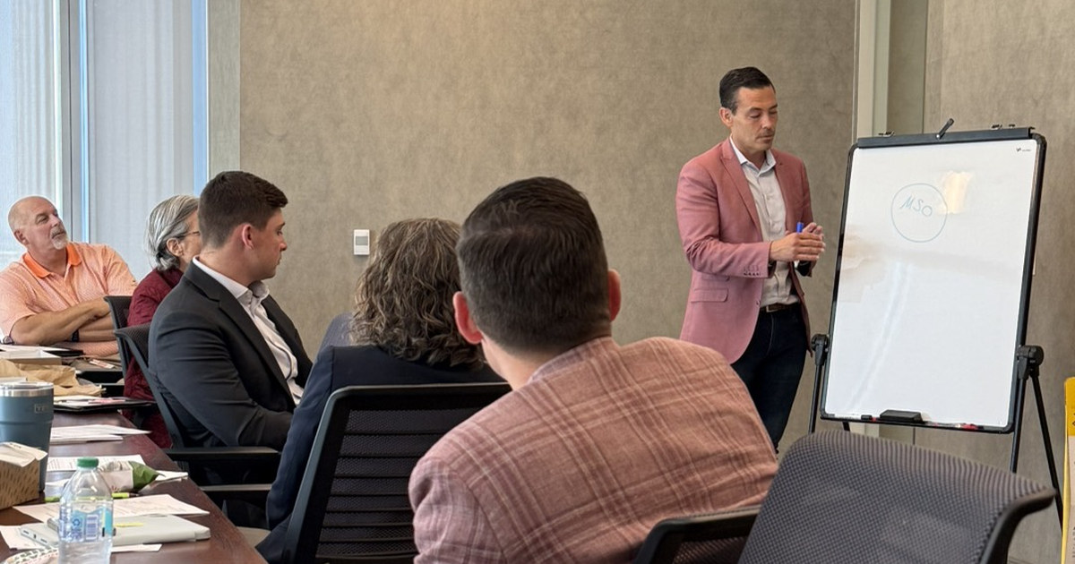 Alex Jones of Guardian Tax Consultants presenting MSO structure on a whiteboard to commercial, credit, treasury, and wealth teams at Bank of Oklahoma in Oklahoma City.